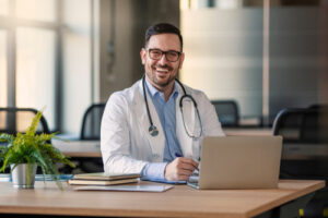 Doctor,Man,Sitting,At,The,Desk,At,His,Working,Place